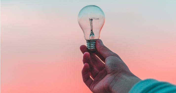 lightbulb hand holding lightbulb